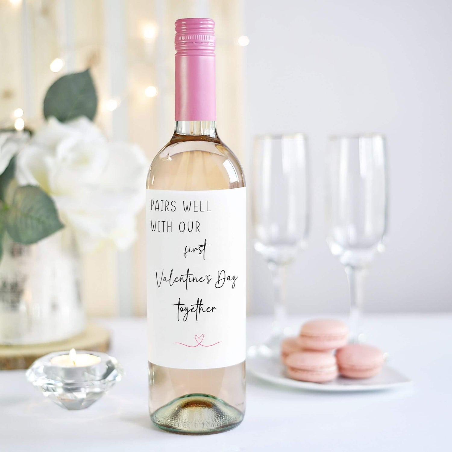 Custom wine label for Valentine's Day with romantic message and elegant design, held against a decorative background.