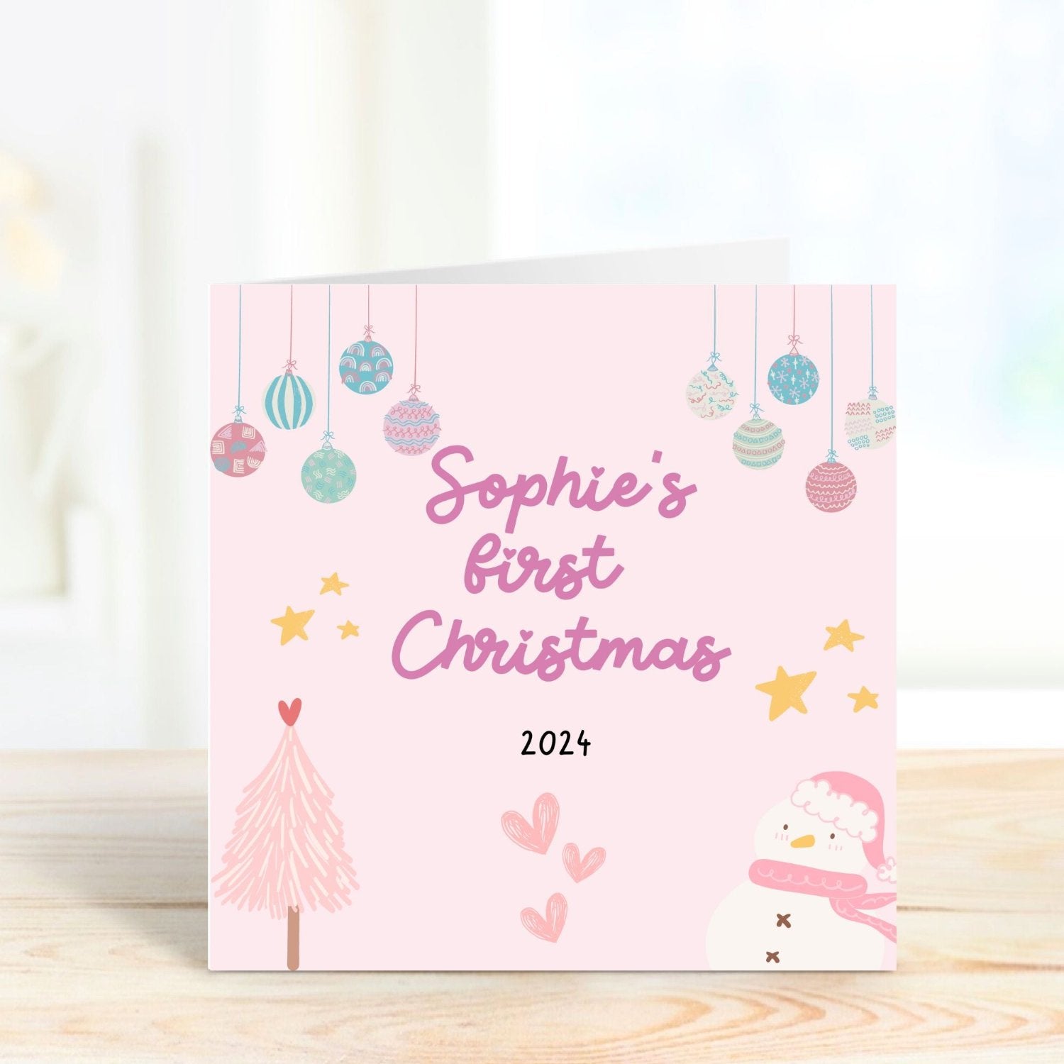 pink christmas card to celebrate first christmas