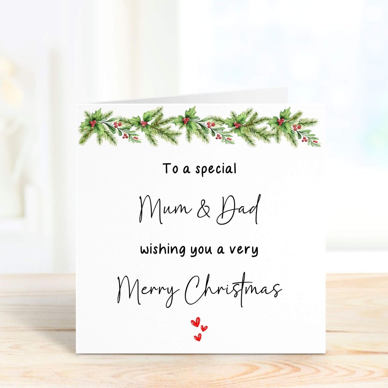 Personalised Christmas card for Mum & Dad with festive foliage design, featuring a custom message option inside. Perfect 5.5 x 5.5-inch card for Christmas.