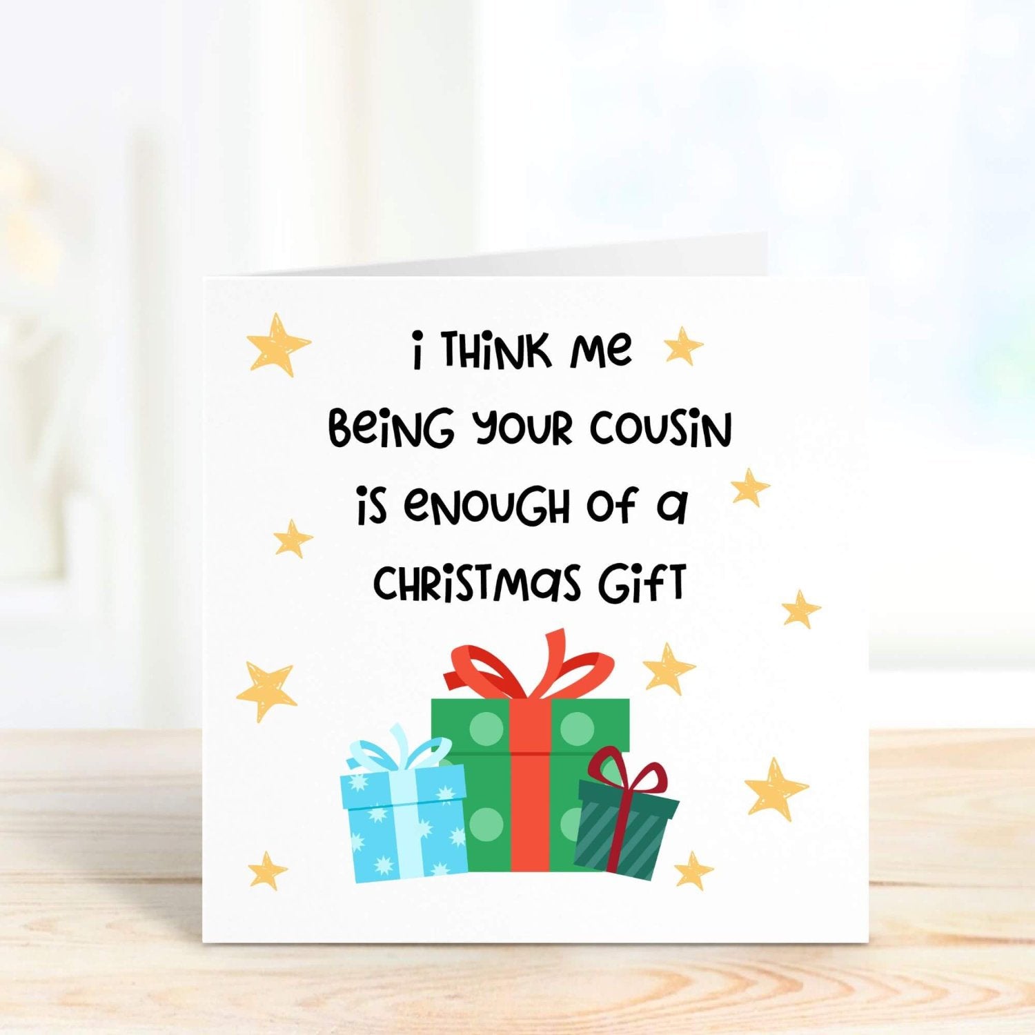 Humorous Christmas card for a cousin, featuring wrapped presents and bright stars, with the funny message, "Me being your cousin is enough of a Christmas gift."