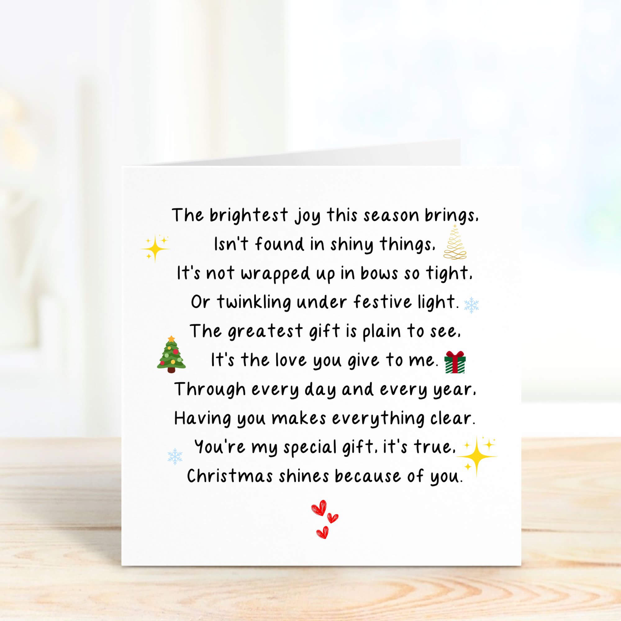 Inside of a personalised Christmas card with a sentimental poem, decorated with festive illustrations including a tree and gift, ideal for sending Christmas wishes to loved ones.