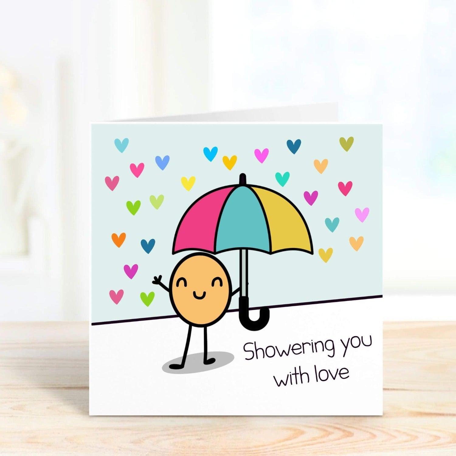 cute personalised card with a doodle handling an umbrella and the words showering you with love