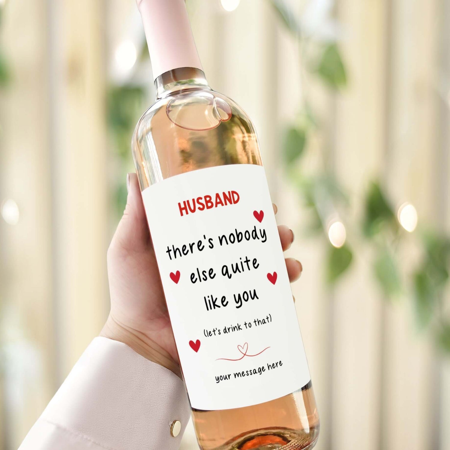 A wine bottle with a Valentine’s Day label reading "Husband, there’s nobody else quite like you. Let’s drink to that!