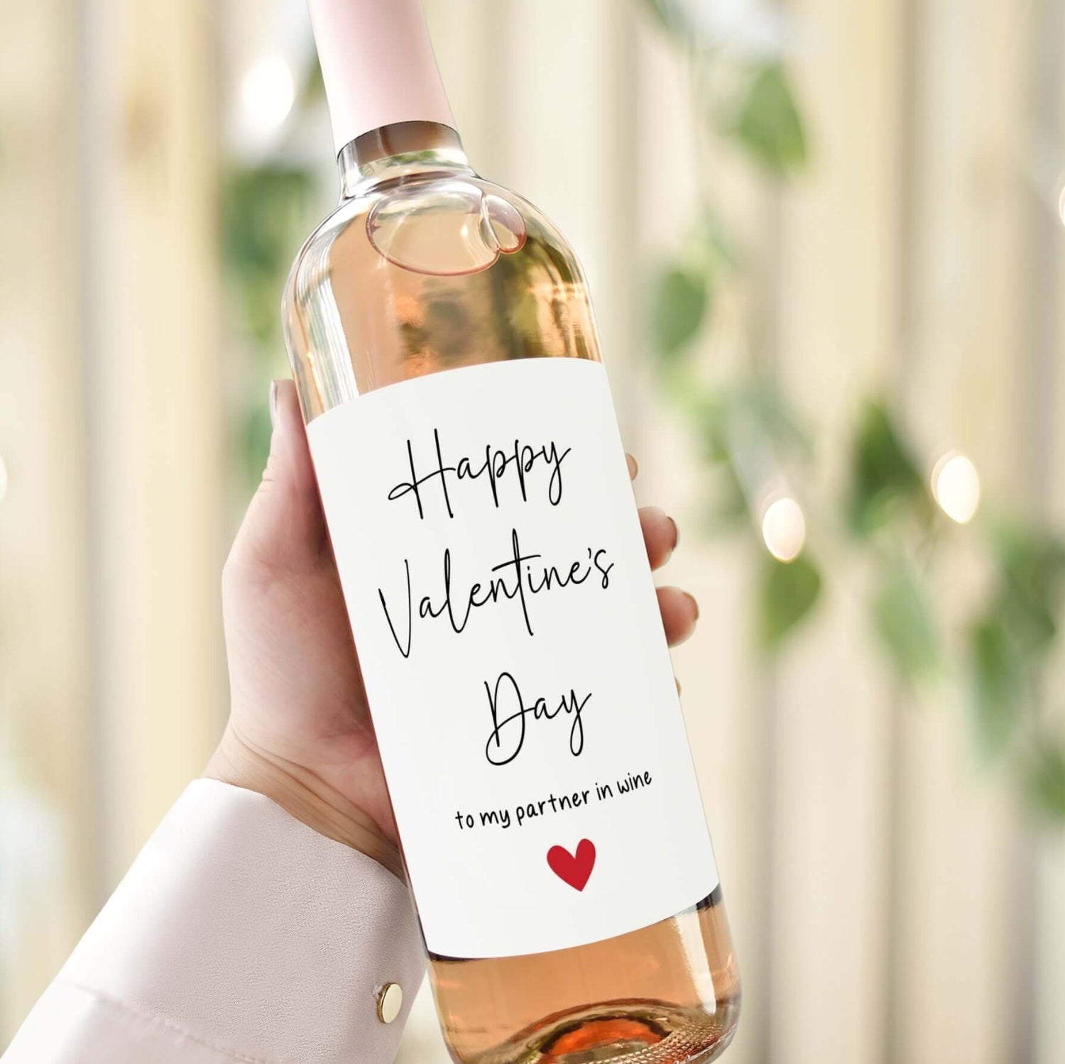 Personalised Valentine’s Day wine label reading 'Happy Valentine’s Day to my partner in wine' with a red heart design.