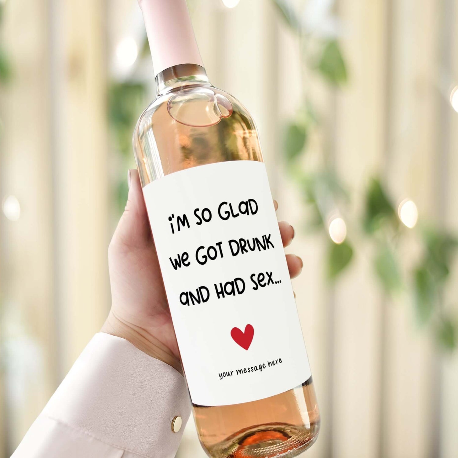 A wine bottle with a cheeky Valentine’s Day label reading "I’m so glad we got drunk and had sex.