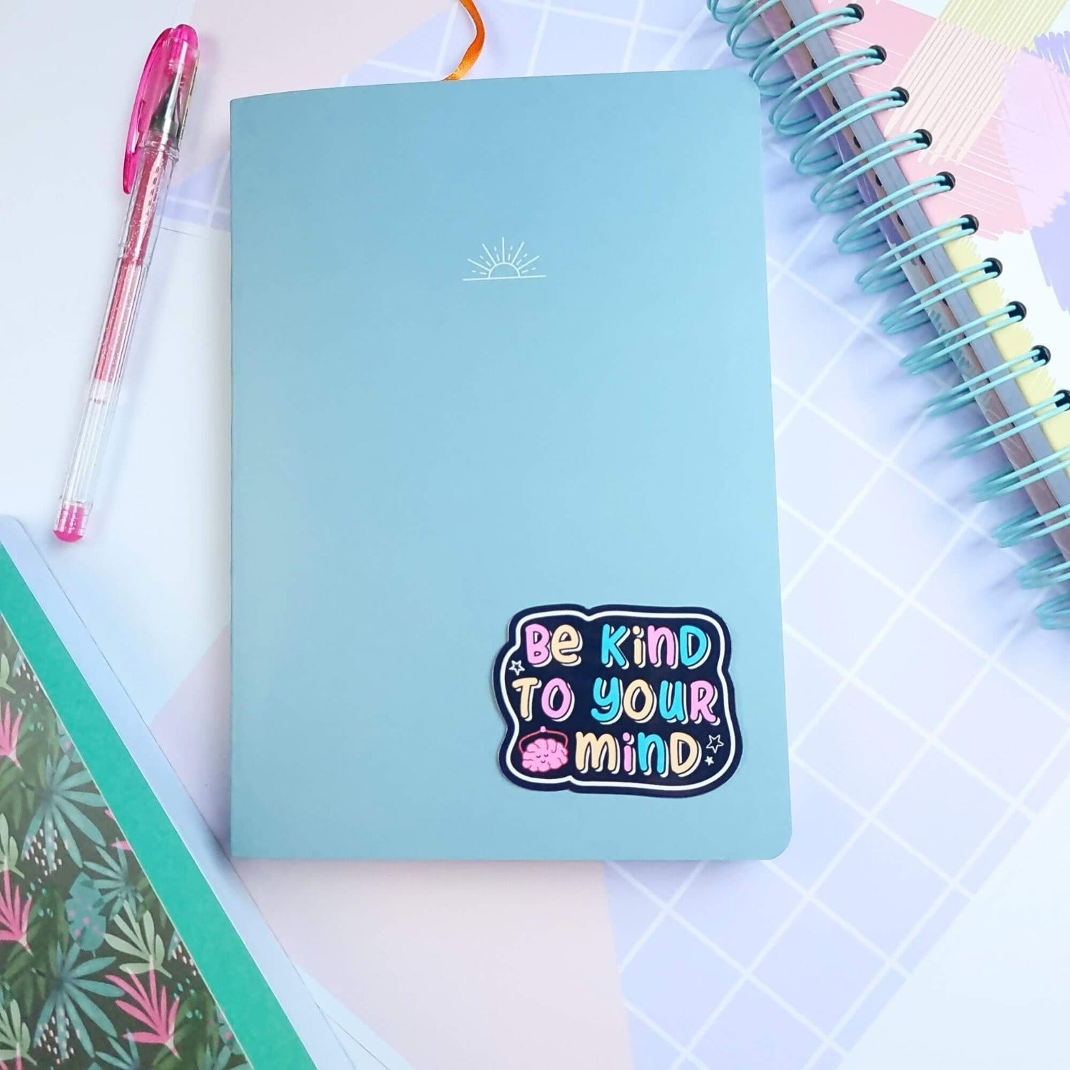 vinyl sticker be kind to your mind on a notebook